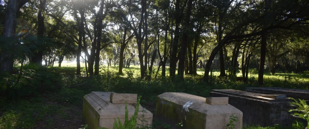 Historic graves beneath oak trees in Romeo Cemetery in Marion County, Florida