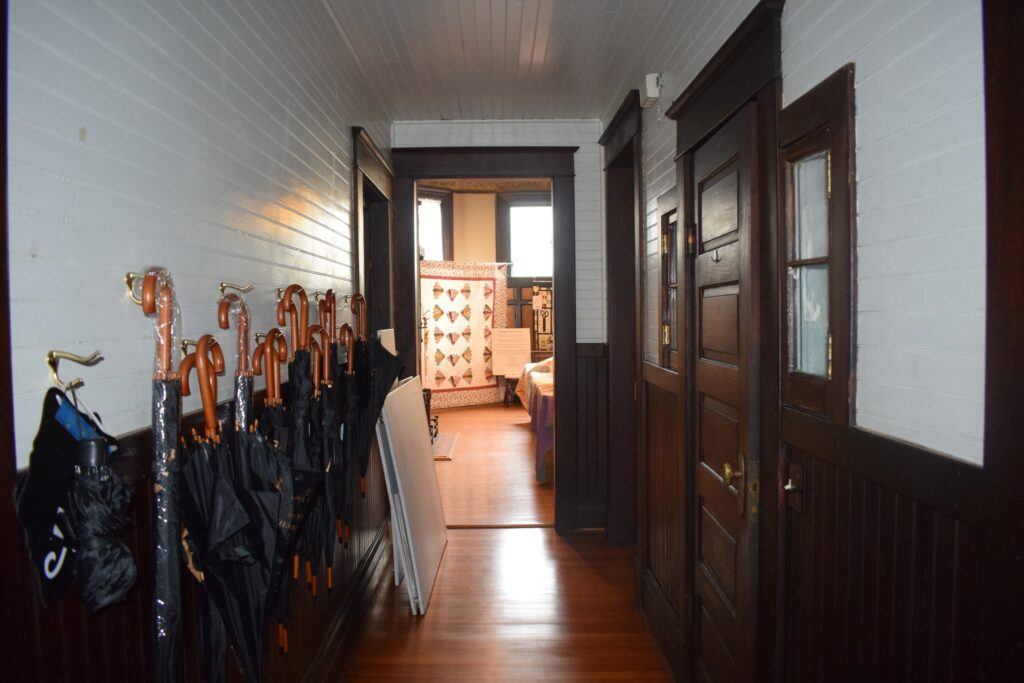 Visitors exploring the restored rooms of the J.D. Holman House