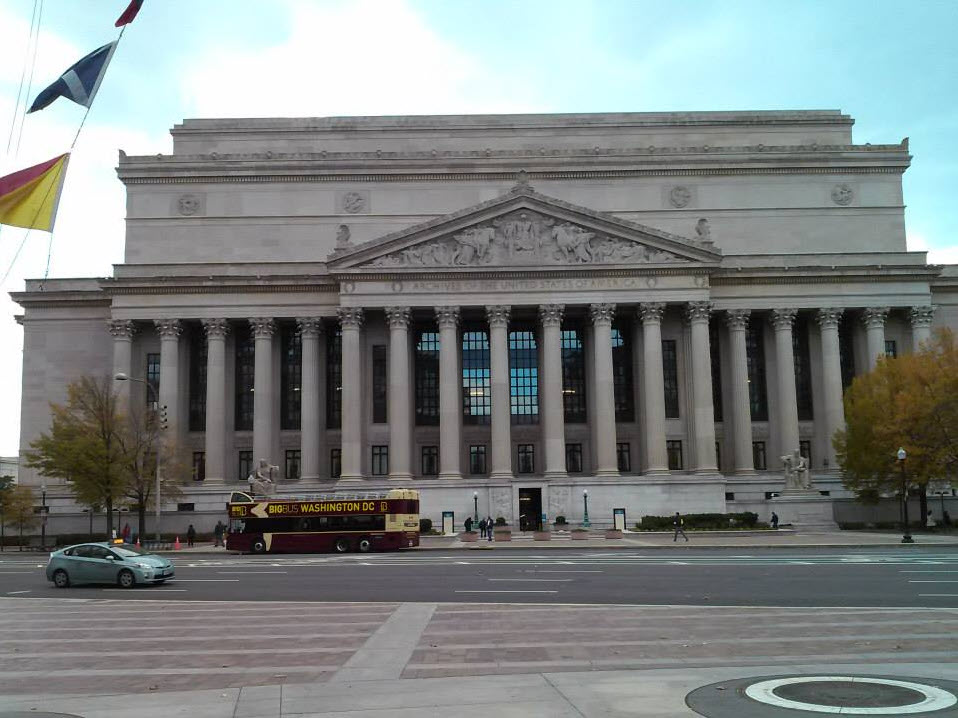 The front of the National Archives Building outside in Washington DC from across the street.