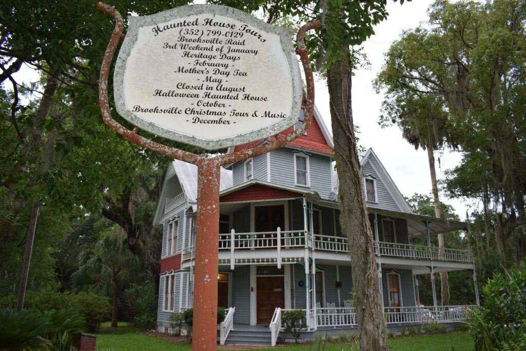 The May-Stringer House in Brooksville, Florida at dusk, framed by oak moss.