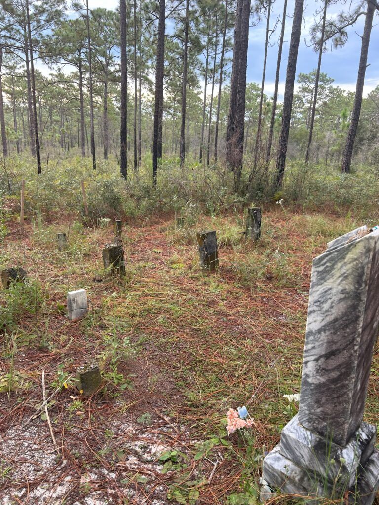 Weathered headstones at Mannfield Cemetery in Citrus County, Florida.