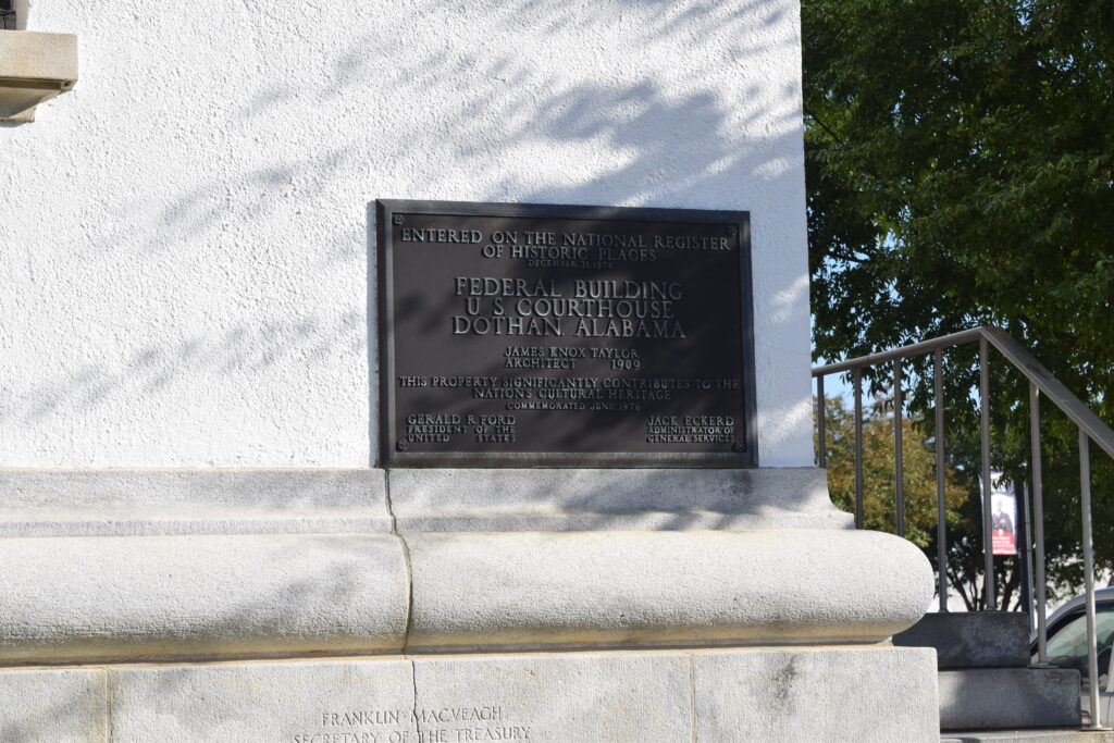 Historic marker in front of the Dothan Federal Building, detailing its construction and significance as an early 20th-century U.S. courthouse and post office.