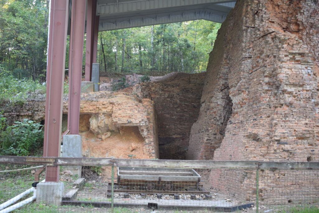 Old railcar in front of the main furnace ruins