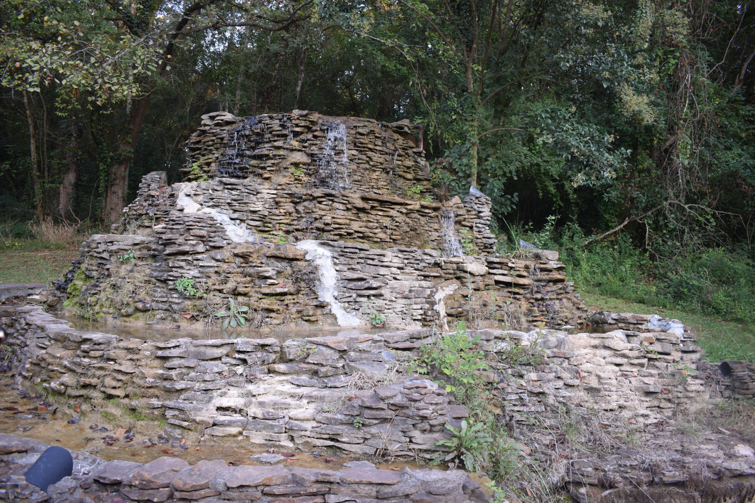 Stone fountain in Orr Park, Montevallo, Alabama, symbolizing beauty emerging from storm damage.