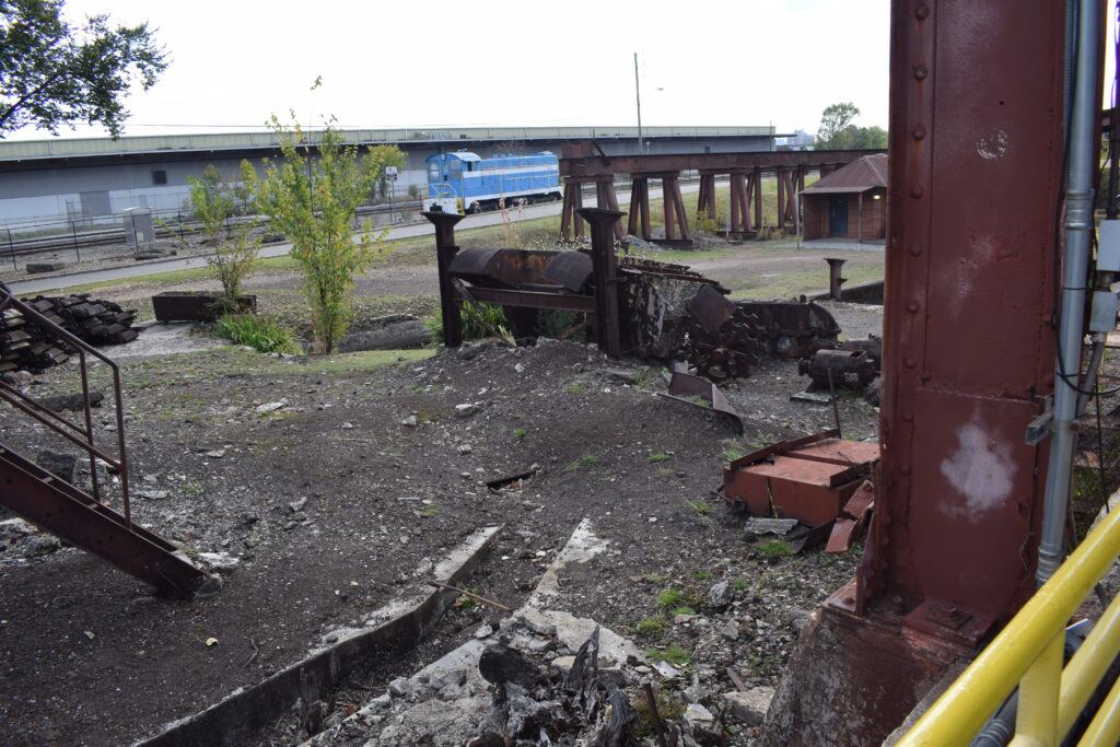 Ki and Dusty exploring the rusted machinery at Sloss Furnaces during Alabama Road Trip