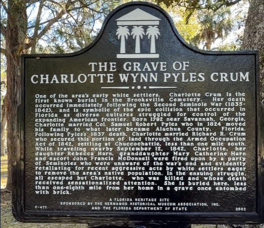 Historical marker for Charlotte Wynn Pyles Crum at Brooksville Cemetery in Brooksville, Florida.