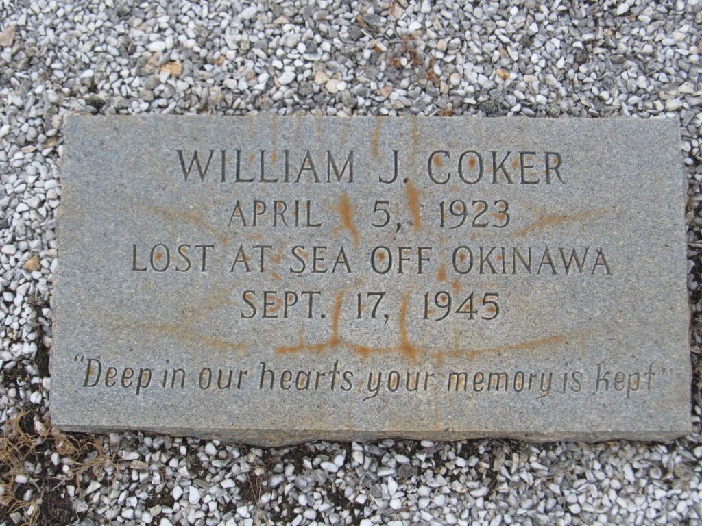 Gravestone of William J. Coker, born April 5, 1923, with inscription noting he was lost at sea off Okinawa on September 17, 1945, and the epitaph “Deep in our hearts your memory is kept.”