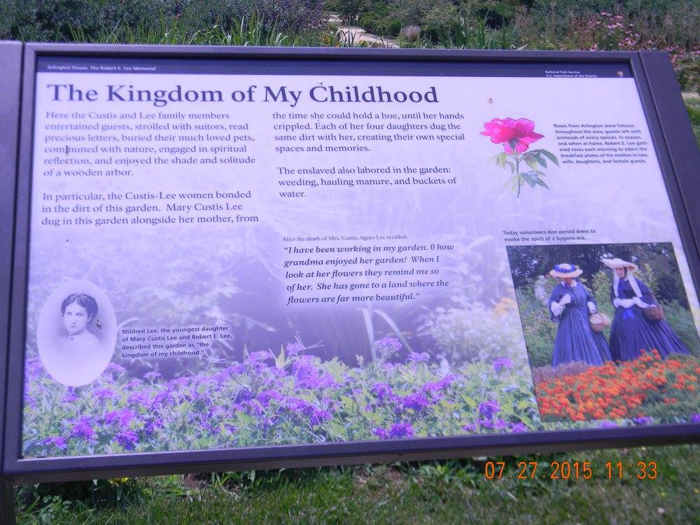 A historical interpretive sign titled “The Kingdom of My Childhood” at Arlington House, describing the Custis-Lee family’s experience while overlooking the garden grounds once worked by enslaved people and later part of Freedman’s Village.
