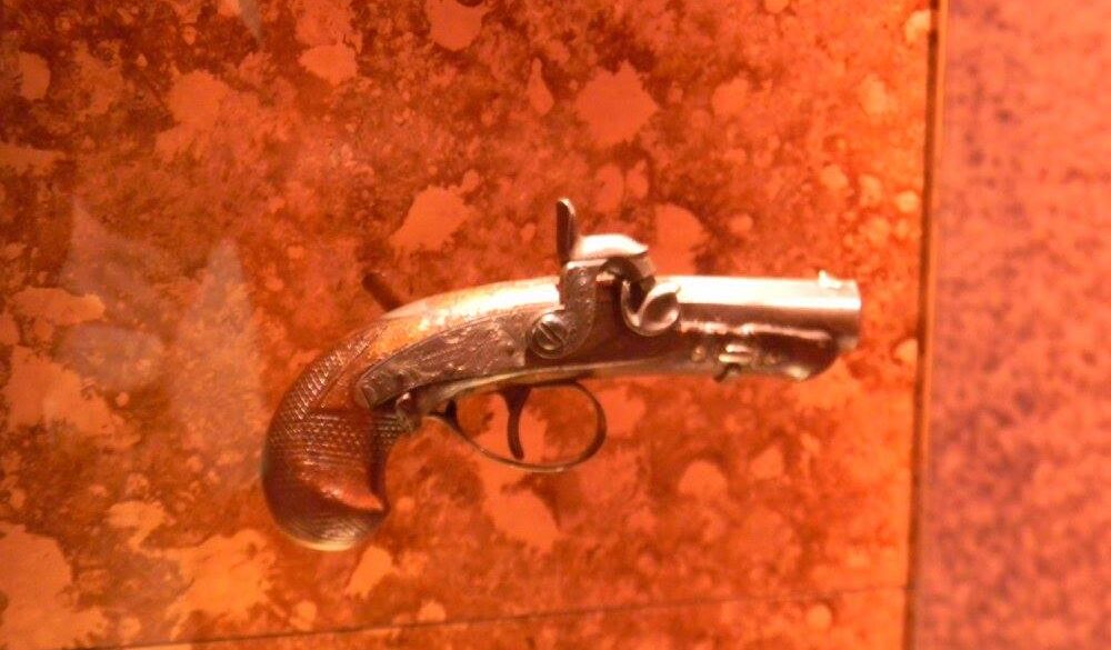 The pistol used by John Wilkes Booth to assassinate Abraham Lincoln on display at Ford’s Theatre museum in Washington, D.C.