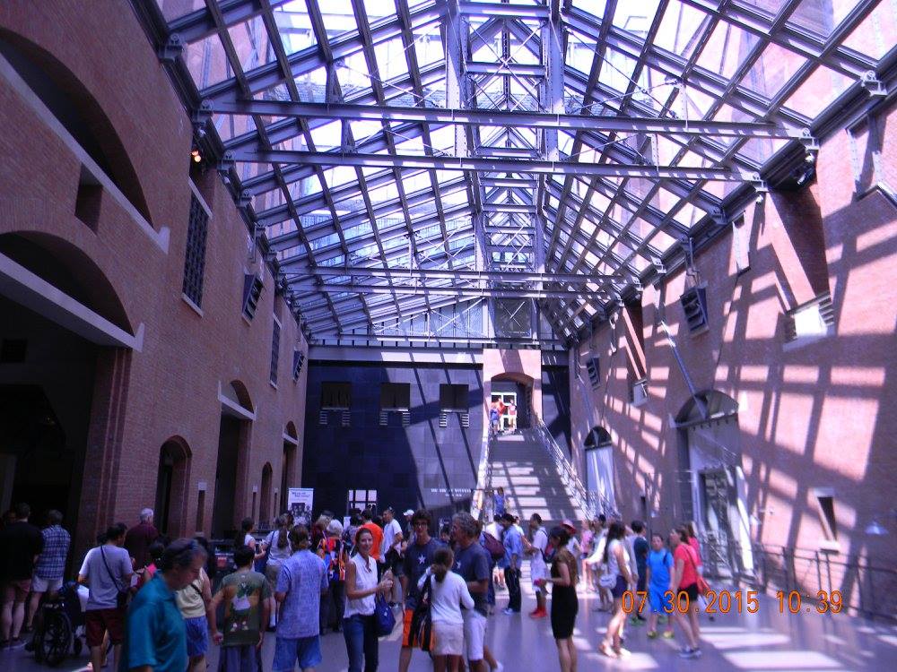 Visitors gather inside the Hall of Witness beneath the glass and steel skylight at the United States Holocaust Memorial Museum in Washington, D.C.