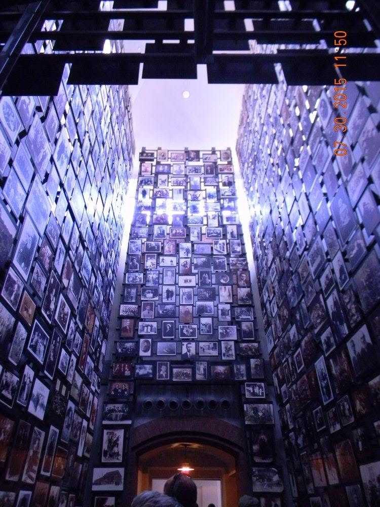 The Tower of Faces exhibit inside the United States Holocaust Memorial Museum in Washington, D.C., displaying hundreds of family photographs from a Jewish community destroyed during the Holocaust.