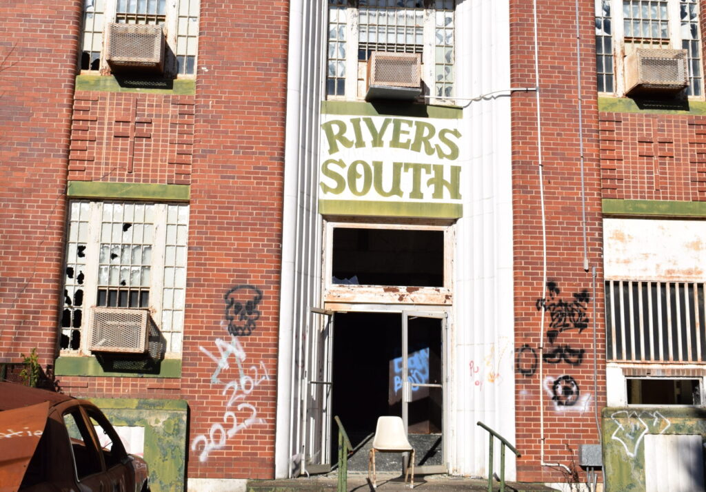 Front entrance of the abandoned Rivers State Prison building at the historic Central State Hospital campus in Milledgeville, Georgia.