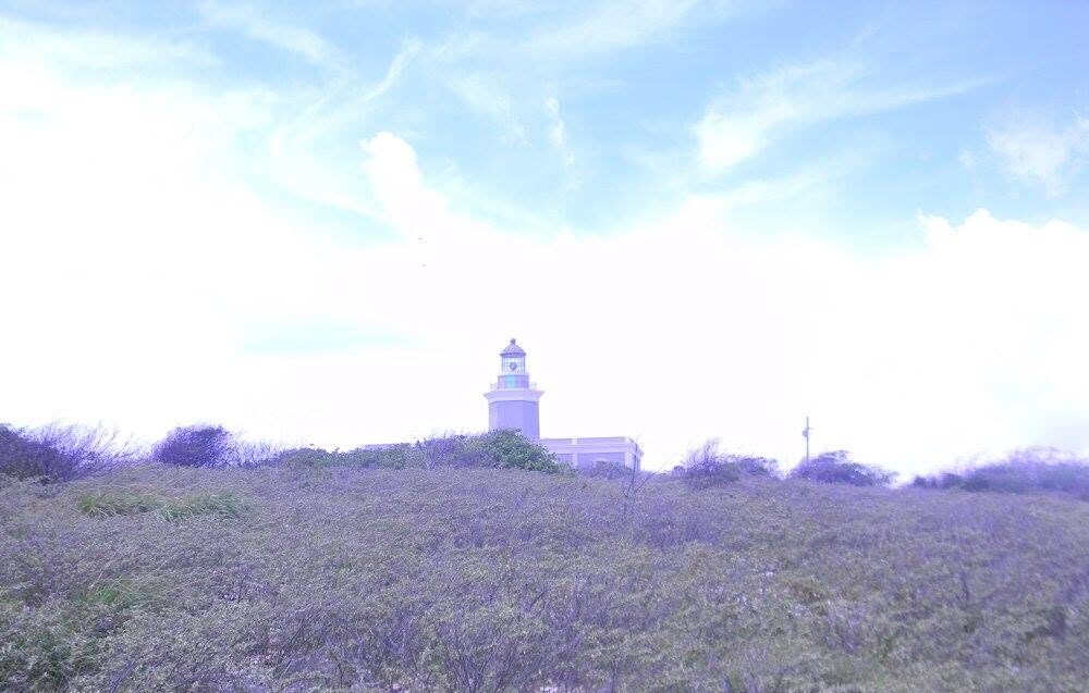 Los Morrillos Lighthouse rising above the coastal landscape in Cabo Rojo, Puerto Rico.