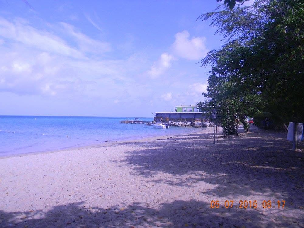 Sandy shoreline and calm blue Caribbean water at Combate Beach in Cabo Rojo, Puerto Rico.