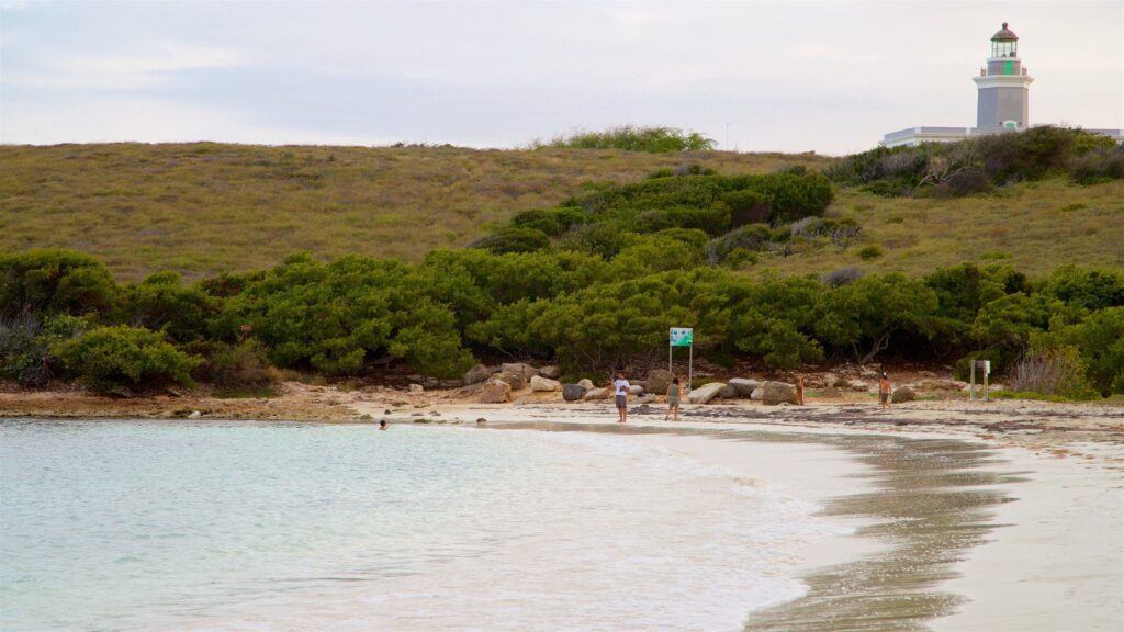 Playa Sucia beach with turquoise water and Los Morrillos Lighthouse on the cliffs in Cabo Rojo, Puerto Rico.