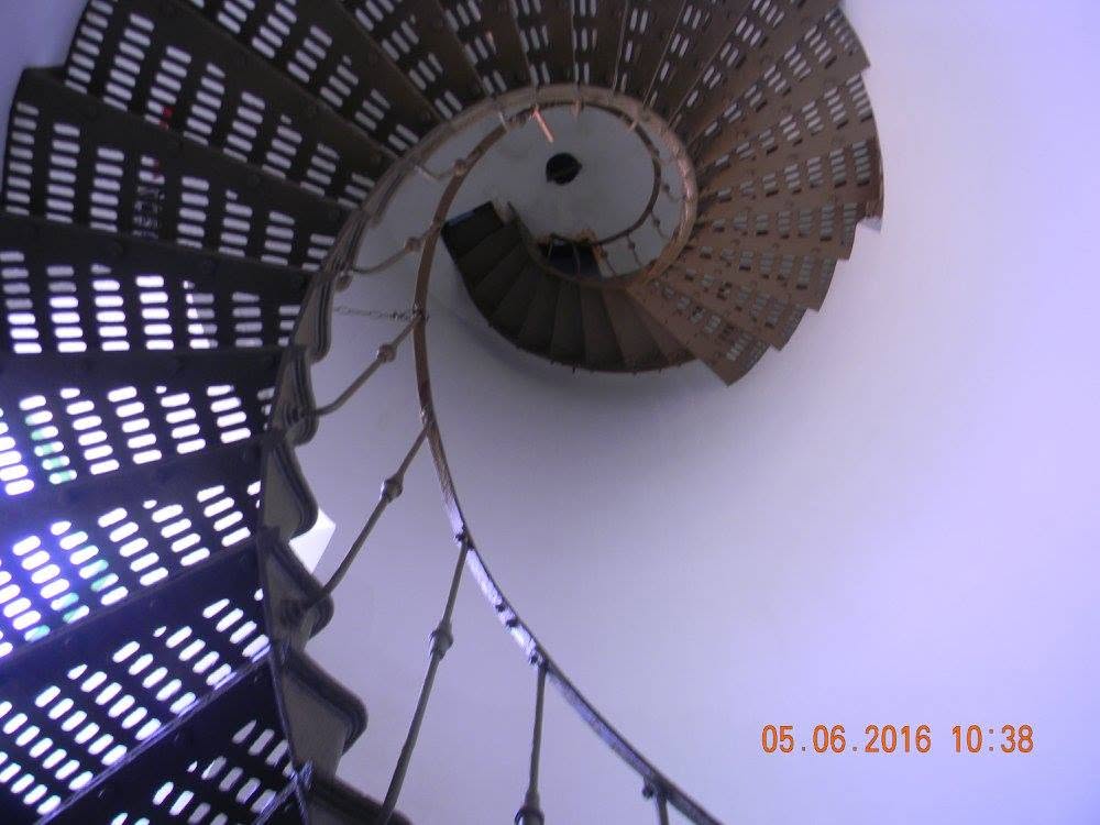 Spiral metal staircase winding upward inside Los Morrillos Lighthouse in Cabo Rojo, Puerto Rico.