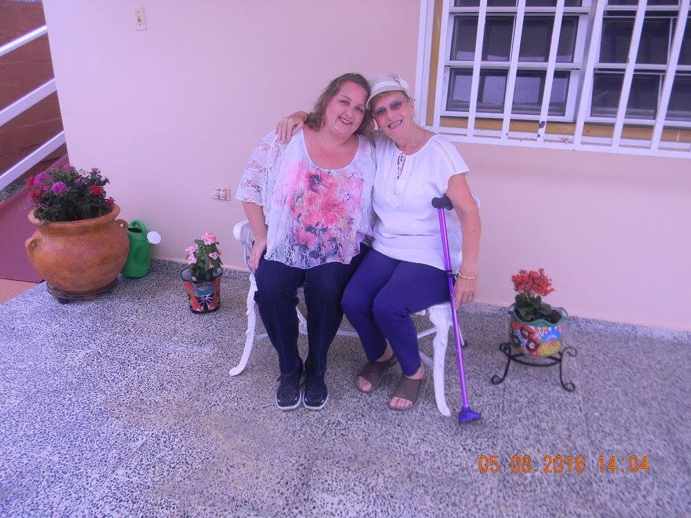 Mother and daughter sitting together outside their home in Puerto Rico on Mother’s Day in May 2016.