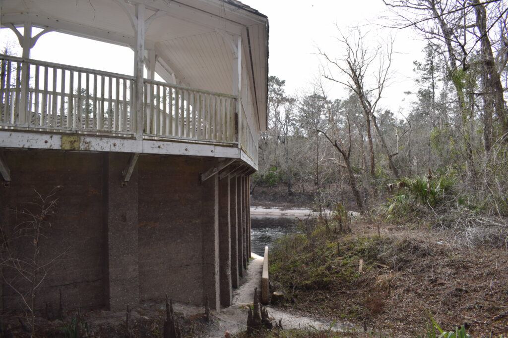Historic White Springs Sulfur Bathhouse overlooking the dark waters of the Suwannee River in White Springs, Florida.