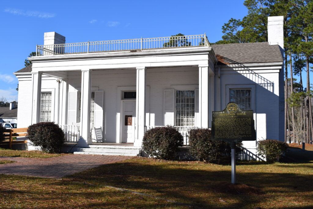 Museum building and Georgia historical marker at the Jefferson Davis Memorial Historic Site near Irwinville, Georgia, where visitors can learn about the capture of Jefferson Davis.