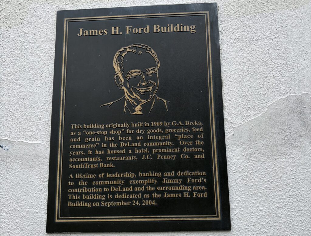 Bronze James H. Ford Building dedication plaque on the historic Dreka Building in downtown DeLand, Florida.