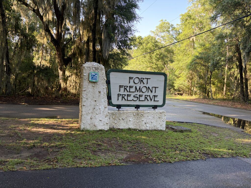 Fort Fremont Preserve entrance sign beneath live oaks and Spanish moss on St. Helena Island, South Carolina.