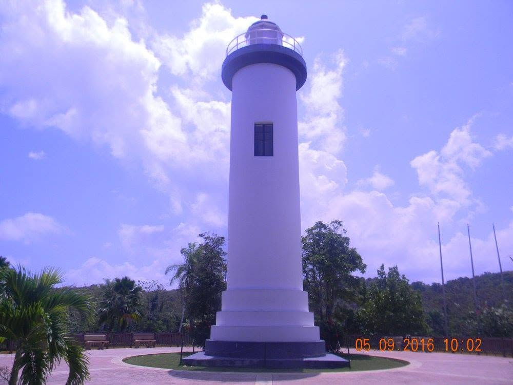 Punta Higüero Lighthouse standing beneath a blue sky in Rincón, Puerto Rico, photographed in May 2016.