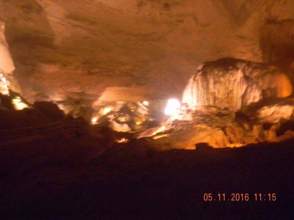 Illuminated limestone formations inside the dark Río Camuy Caves in Puerto Rico during a 2016 cave tour.