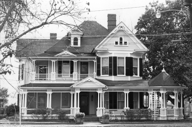 Historic black-and-white photograph of the Luther Henry Caldwell House in Lumberton, North Carolina, showing its porches and Queen Anne architecture.
