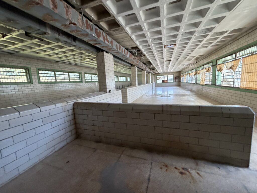 Large empty tiled room inside the forensic building at Trans-Allegheny Lunatic Asylum