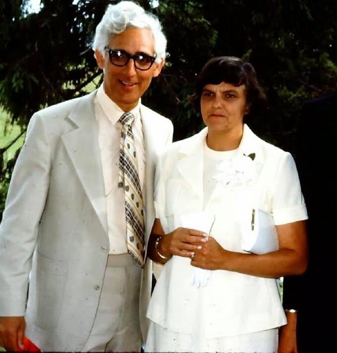 Vintage photograph of Bob and Jean Cornett standing together outdoors, dressed in light-colored formal attire.