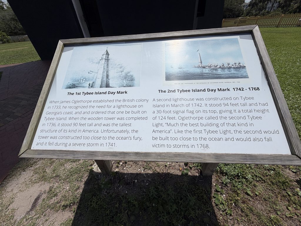 Interpretive sign at Tybee Island Light Station featuring historical illustrations and descriptions of the first wooden daymark built in 1736 and the second daymark constructed in 1742, both destroyed by coastal storms.
